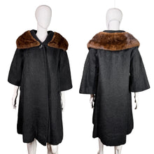 Load image into Gallery viewer, Black coat with brown fur collar on a mannequin against a neutral background

