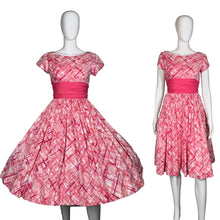 Load image into Gallery viewer, Pink patterned dress on a mannequin with and without petticoat.
