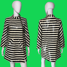 Load image into Gallery viewer, A black and off-white striped jacket displayed on a white mannequin, showing both front and back views.
