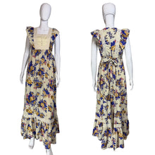 Load image into Gallery viewer, Floral dress on a mannequin against a plain wall.
