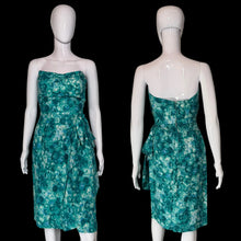 Load image into Gallery viewer, A strapless knee-length dress with a green and white floral pattern, displayed on a white mannequin from both the front and back views.
