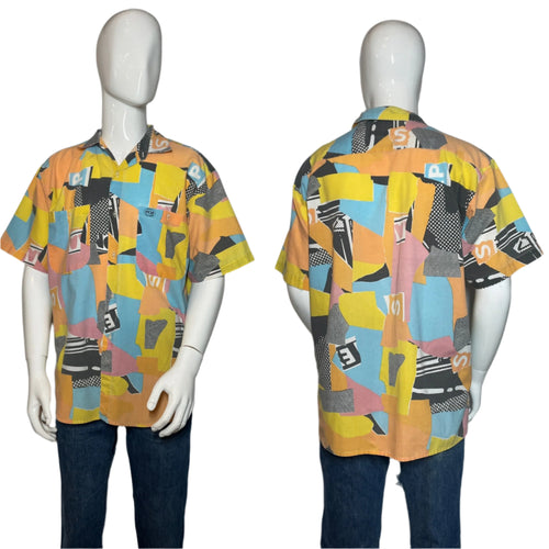 Colorful geometric patterned shirt on a mannequin against a gray background