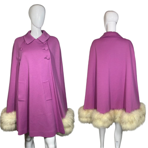 Purple coat with fur trim on a mannequin against a plain background