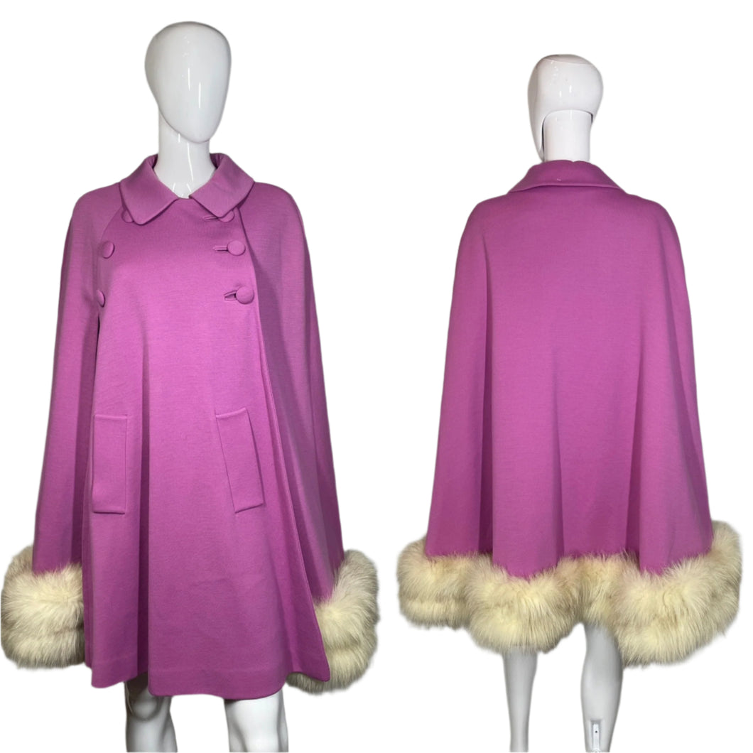 Purple coat with fur trim on a mannequin against a plain background