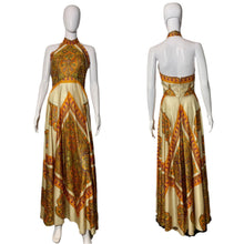 Load image into Gallery viewer, Patterned dress on a mannequin against a plain wall.
