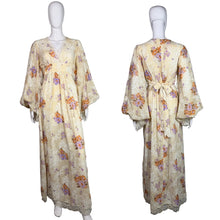 Load image into Gallery viewer, Floral dress on a mannequin against a plain background
