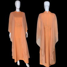 Load image into Gallery viewer, An orange vintage maxi dress with sheer draping sleeves displayed on a white mannequin, showing both front and back views.
