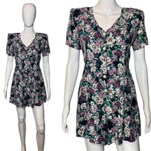 Load image into Gallery viewer, Floral romper on a mannequin against a plain background
