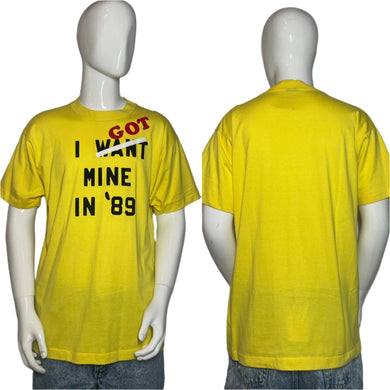 Yellow t-shirt with text on a mannequin against a plain background