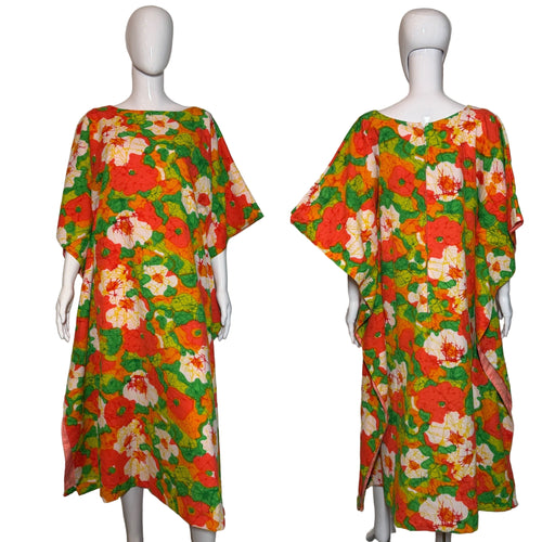 Colorful floral dress on a mannequin against a plain background