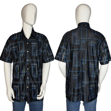 Black and blue geometric patterned shirt on a mannequin against a plain background