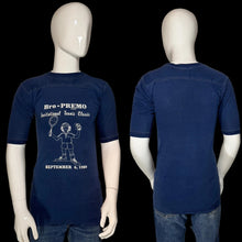 Load image into Gallery viewer, Front and back views of a navy blue short-sleeve t-shirt displayed on a white mannequin. The front features a white graphic print of a tennis player and the text 'Bro - PREMIO Invitational Tennis Classic SEPTEMBER 5, 1990'.
