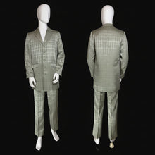 Load image into Gallery viewer, A men's two-piece suit displayed on a white mannequin, showing both front and back views. The suit is a silvery sage green with a fine windowpane plaid pattern.
