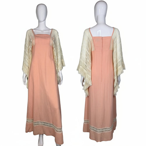 Front and back view of a pink dress with lace accents against a plain wall.