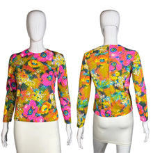 Load image into Gallery viewer, Colorful floral-patterned top on a mannequin against a neutral background

