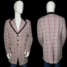 Load image into Gallery viewer, A men's patterned blazer shown on a white mannequin from both front and back views. The blazerfeaturing a dusty pink and red floral pattern with black velvet lapels and black buttons.
