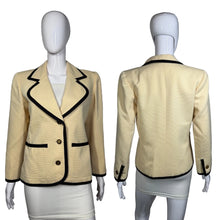 Load image into Gallery viewer, Beige blazer with black trim on a mannequin against a gray background
