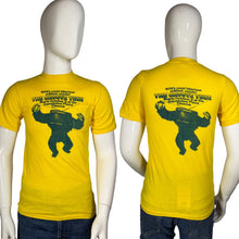 Load image into Gallery viewer, Yellow t-shirt with graphic design on a mannequin against a white background
