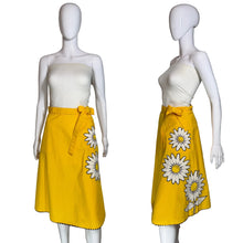 Load image into Gallery viewer, Yellow skirt with a white floral applique against a white background.
