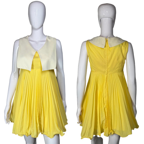 Yellow dress on a mannequin with a plain background