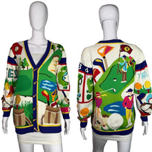 Load image into Gallery viewer, Colorful sweater with golf-themed design on a mannequin against a gray background
