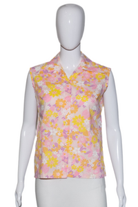 Mannequin wearing a sleeveless floral top and white skirt on a white background