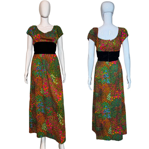 Colorful floral dress on a mannequin against a plain background.