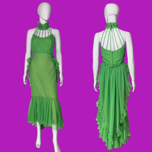 Load image into Gallery viewer, A bright green halter-neck dress with ruffle details, shown on a white mannequin from both the front and back.
