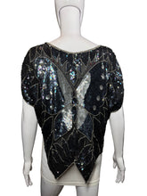 Load image into Gallery viewer, Mannequin wearing a black sequin top with leaf patterns on a plain background
