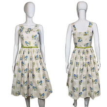 Load image into Gallery viewer, Floral dress on a mannequin against a neutral background
