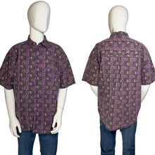 Load image into Gallery viewer, Short-sleeve shirt with a purple geometric pattern on a mannequin against a neutral background
