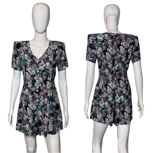 Floral dress on a mannequin against a plain background
