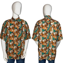 Load image into Gallery viewer, Mannequin wearing a patterned shirt with a brown and teal geometric design
