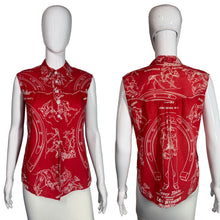 Load image into Gallery viewer, Red sleeveless shirt with white graphic design on mannequins against a white background
