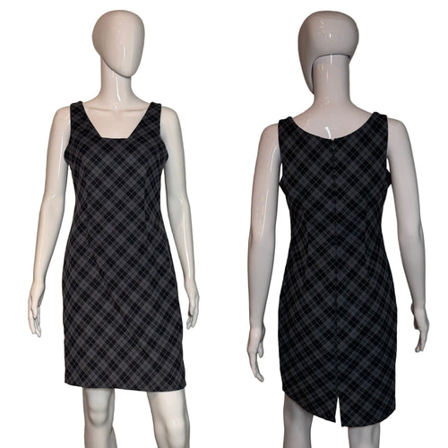 Black plaid dress on a mannequin against a neutral background