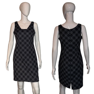 Black plaid dress on a mannequin against a neutral background