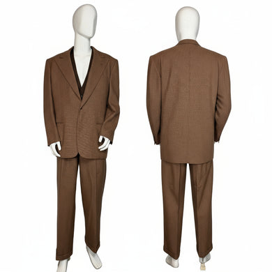 Brown suit displayed on a mannequin against a white wall.