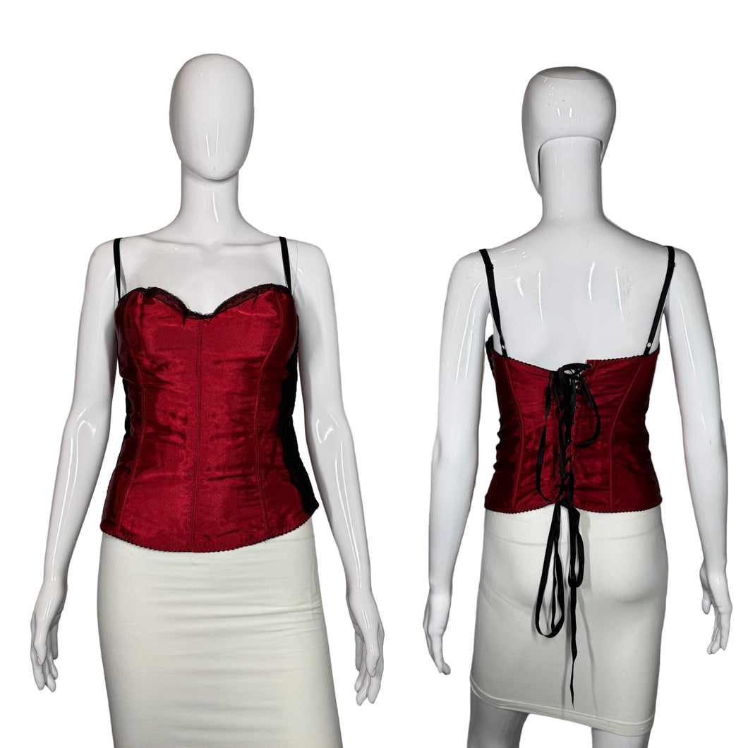 Red corset top on a mannequin against a gray background