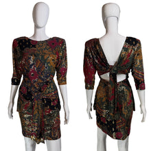 Load image into Gallery viewer, Patterned dress on a mannequin with a plain background.
