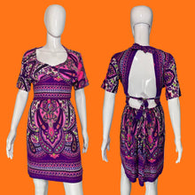 Load image into Gallery viewer, A purple and pink paisley print short-sleeve dress displayed on a white mannequin.
