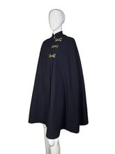 Load image into Gallery viewer, Navy blue cape with gold buckles on a mannequin against a plain background

