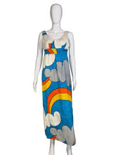 Load image into Gallery viewer, Colorful dress with cloud and rainbow design on a mannequin against a plain wall.
