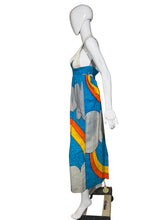 Load image into Gallery viewer, Colorful dress with cloud and rainbow design on a mannequin against a plain wall.
