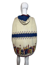 Load image into Gallery viewer, Decorative hooded cape with colorful patterns on a mannequin against a plain background
