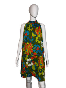 Floral-patterned dress on a mannequin against a plain background