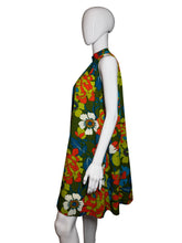 Load image into Gallery viewer, Mannequin wearing a colorful floral dress on a plain background
