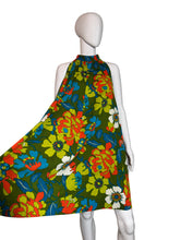 Load image into Gallery viewer, Colorful floral patterned fabric on a mannequin arm against a plain background
