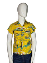 Load image into Gallery viewer, Yellow patterned shirt on a mannequin against a white background
