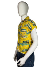 Load image into Gallery viewer, Yellow patterned shirt on a mannequin against a white background
