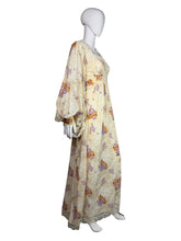 Load image into Gallery viewer, Floral dress on a mannequin against a plain background
